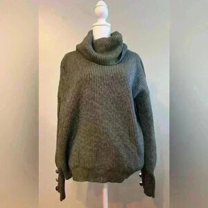 medium cowl neck sweater, button detail on the sleeve.